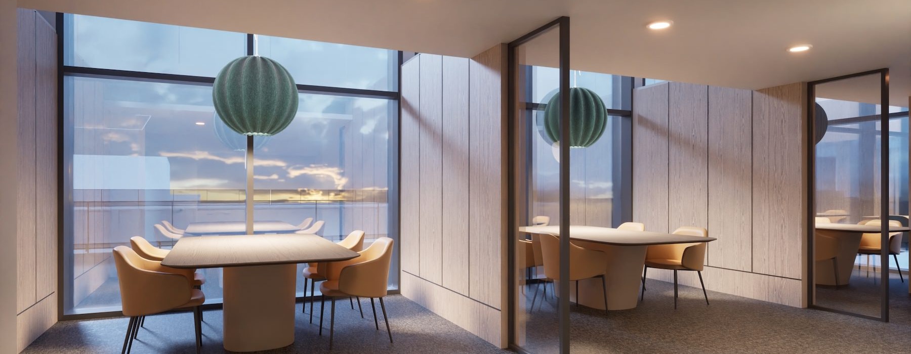 a work room with tables and chairs by large windows