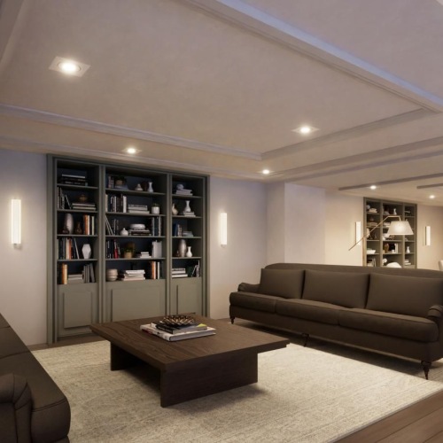 a lounge room with a large bookcase and a wood floor