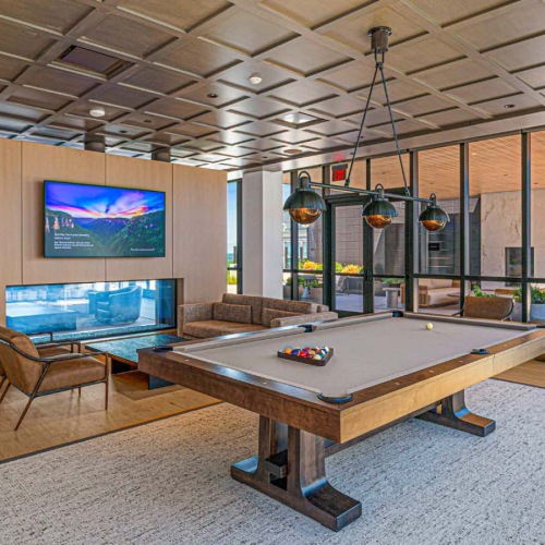 resident lounge with pool table and fireplace