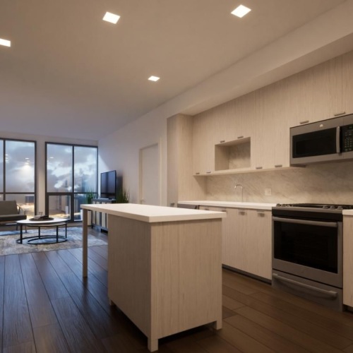 a kitchen with a wood floor an island and white cabinets