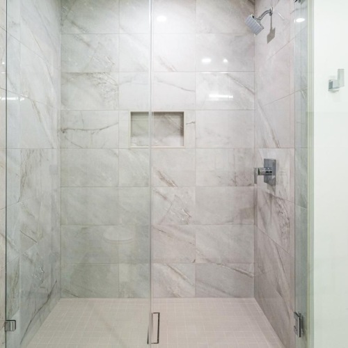 a shower with glass doors