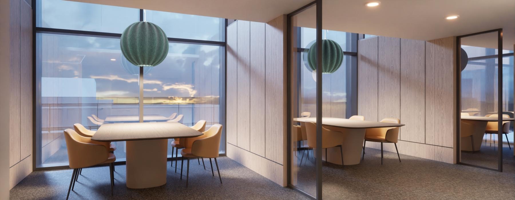 a work room with tables and chairs by large windows