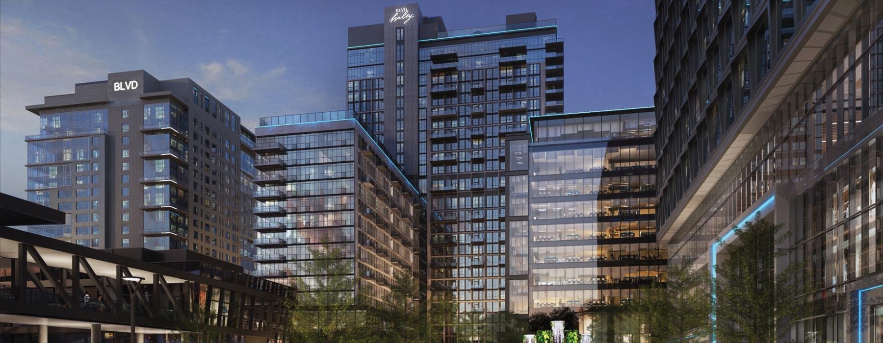 a group of buildings with people walking around